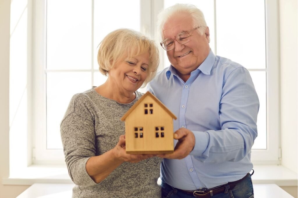 Couple with a model house
