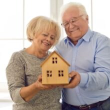 Couple with a model house
