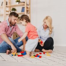 Couple playing with a child.