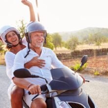 Couple on motor scooter