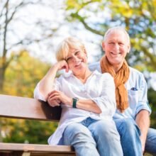 Senior couple sitting together on a bench