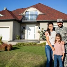 Military family in front of their home